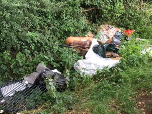 fly tipping at Aston Bridge - mixture of household waste