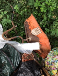 fly tipping at Aston Bridge - waste wheel barrow and other black sacks