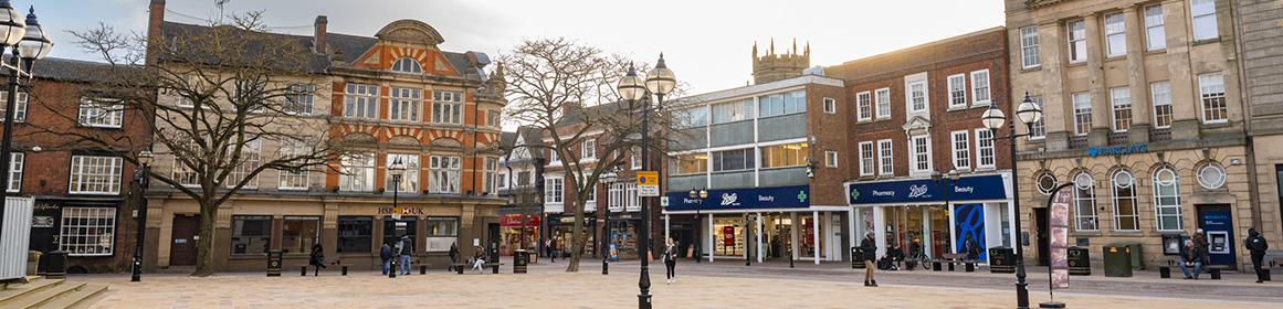 Market Square in Stafford Town Centre with people walking on an Autumn day