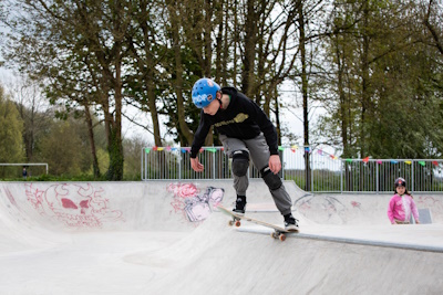 young person on a skateboard at a skate park