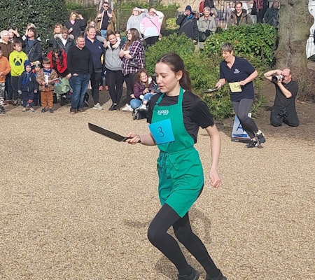 girl running with frying pan