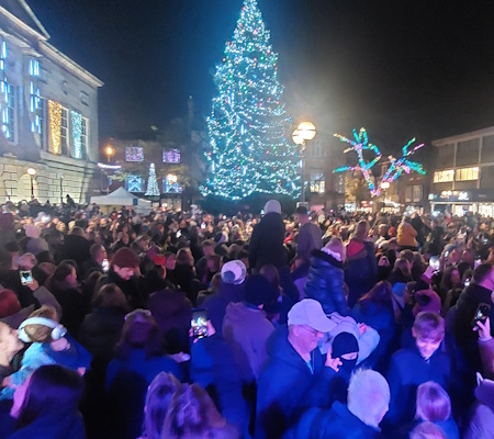 crowds watching christmas lights being switched on in stafford